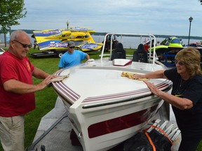 From left, Billy Sewell, George Sewell and Martha Atkins give Veri Cheri a shine as participants in the 1000 Islands Regatta arrive at Centeen Park in Brockville ahead of the 2019 event. (aFILE PHOTO)