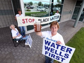 Chatham-Kent residents have been raising concerns for years after several water wells in the North Kent Wind farm area of Chatham Township began getting clogged with sediments during and after 34 industrial wind turbines were erected. A group of residents are seen in this June 28, 2017 file photo conducting a sit-in at the Ministry of of Environment and Climate Change office in Windsor. The Ministry of Health has received an All-Hazard Investigation of Well Water in Chatham-Kent report by an expert panel. PHOTO Jason Kryk/Windsor Star