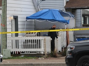 An officer with the Chatham-Kent police forensic unit comes out of a Lorne Avenue home on Wednesday where shots were fired just after midnight. There were no injuries and police said it is a targeted incident and there is no threat to public safety. PHOTO Ellwood Shreve/Chatham Daily News