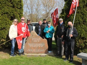 A small group took part in a National Day of Mourning event on Thursday organized by Unifor that was held at the monument to remember fallen workers located on Grand Avenue West in Chatham.  Pictured from left, is: Michelle Ritchie, Chris Ritchie, Dennis Kersey, Jeff McFadden, Doris Zilio, Derry McKeever and Bill Zillo.  PHOTO Ellwood Shreve/Chatham Daily News
