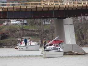 A flotilla of Thames River Yacht Club members motored up the Thames River from Lighthouse Cove to Chatham on Saturday to renew a tradition that took place several years ago.  Some of the vessels are seen here arriving at the municipal docks in downtown Chatham.  PHOTO Ellwood Shreve/Chatham Daily News