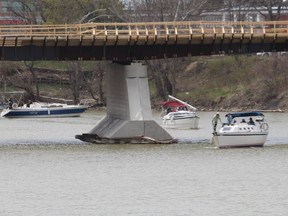 A flotilla of Thames River Yacht Club members motored up the Thames River from Lighthouse Cove to Chatham on Saturday to renew a tradition that took place several years ago.  Some of the vessels are seen here arriving at the municipal docks in downtown Chatham.  PHOTO Ellwood Shreve/Chatham Daily News