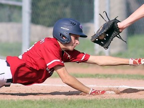 Chatham Diamonds baserunner Camden Blackburn stretches to beat the tag by Seaway Surge first baseman Jack LaBrash on a pickoff attempt during a Baseball Ontario minor bantam playoff game at Fergie Jenkins Field at Rotary Park on Aug. 22, 2021. This photo earned Chatham Daily News sports reporter Mark Malone an Ontario Newspaper Award for Sports Photography (under 25,000 circulation).
