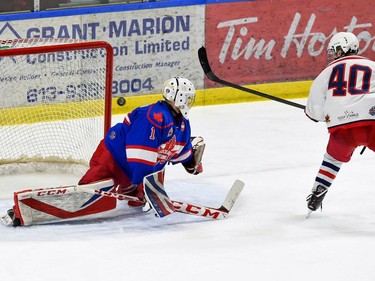 Rockland Nationals goaltender Jack McGovern eyes a rebound over his left shoulder from a shot by Cornwall Colts affiliate player Brayden Besner, on Thursday April 7, 2022 in Cornwall, Ont. The Colts won 2-1 in the SO. Robert Lefebvre/Special to the Cornwall Standard-Freeholder/Postmedia Network