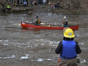 Participants during the 2022 Raisin River Canoe Race, with a firefighter standing close by on Sunday April 10, 2022 in South Stormont, Ont. Shawna O'Neill/Cornwall Standard-Freeholder/Postmedia Network