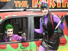 Leslie Labelle as Punchline, and Joker Tyson Labelle, striking a pose in the Jurassic Park Jeep on Saturday, April 23, 2022, in Cornwall, Ont. Todd Hambleton/Cornwall Standard-Freeholder/Postmedia Network