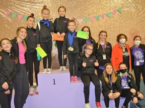 Some Level Three Session coaches and competitors of Cornwall Gymnastics Club posing with Sen. Bernadette Clement (back row, right) at the Cotton Candy Classic competition on Saturday April 23, 2022 in Cornwall, Ont. Seen are Gwendolyn Blackadder, Ella Lalonde, Rosie Pulfer, Ella Lapointe, Violet Ruest, Piper Brunet, Marisa Bradley, Olivia Baillie, Keaton MacDonald, Keira Villeneuve, Carine MacLaughlin, and Kayla Presseault.
Shawna O'Neill/Cornwall Standard-Freeholder/Postmedia Network