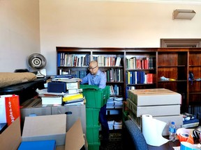 Leon Wu, a volunteer at the UELAC archives at the Dominion Office in Toronto, getting things ready for this week's move to Cornwall. Handout/Cornwall Standard-Freeholder/Postmedia Network