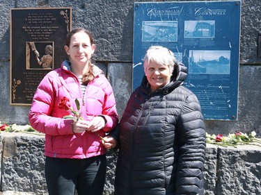 Wendy Stephen and Louise Lanctot on the National Day of Mourning at the worker's monument in Lamoureux ParkThursday April 28, 2022 in Cornwall, Ont. Laura Dalton/Cornwall Standard-Freeholder/Postmedia Network