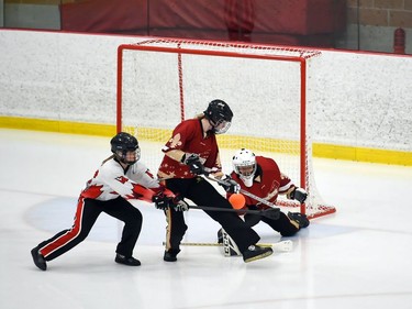 Seaway Devils Alexane Paquette tries to get her stick on the ball in front of T-Miss goaltender Laurie Sirois during opening juvenile women's action at the 2022 Broomball Canada juvenile championships on Wednesday April 13, 2022 in Cornwall, Ont. The Devils won 2-0. Robert Lefebvre/Special to the Cornwall Standard-Freeholder/Postmedia Network