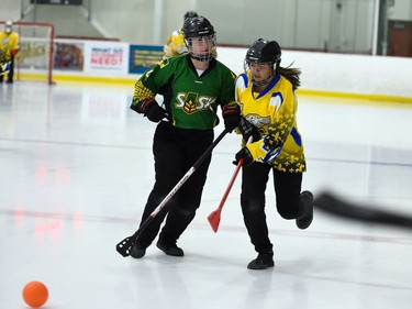 A Quebec Blizzards player jostles with an Aberdeen Attackers player during opening juvenile women's action at the 2022 Broomball Canada juvenile championships on Wednesday April 13, 2022 in Cornwall, Ont. The Blizzards won 1-0 in OT. Robert Lefebvre/Special to the Cornwall Standard-Freeholder/Postmedia Network
