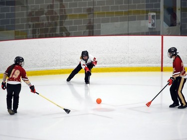 Seaway Devils Kayla Derouchie fires the ball through two T-Miss players during opening juvenile women's action at the 2022 Broomball Canada juvenile championships on Wednesday April 13, 2022 in Cornwall, Ont. The Devils won 2-0. Robert Lefebvre/Special to the Cornwall Standard-Freeholder/Postmedia Network