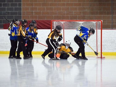 Debden Roadrunners Rhyan Amundson clears the ball from goaltender Ayla Peterson's crease during 2022 Broomball Canada Juvenile National Championships play against the T-Miss on Wednesday April 13, 2022 in Cornwall, Ont. The Roadrunners won 3-2. Robert Lefebvre/Special to the Cornwall Standard-Freeholder/Postmedia Network