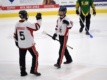 Mildmay Jr. Moose Layne Grubb congratulates teammate Ashton Cobean for his goal against the Bruno Axemen during the bronze-medal match at the 2022 Broomball Canada National Juvenile Championship on Saturday April 16, 2022 in Cornwall, Ont. The Jr. Moose won 3-1. Robert Lefebvre/Special to the Cornwall Standard-Freeholder/Postmedia Network