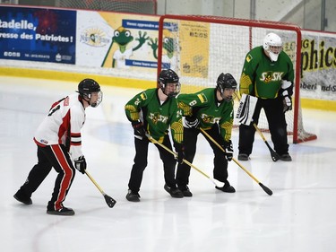Mildmay Jr. Moose Owen Garland, left, lines up with Bruno Axemen Matthew Solar and Dylan Boskill in front of Trae Basset's crease during the bronze-medal match at the 2022 Broomball Canada National Juvenile Championship on Saturday April 16, 2022 in Cornwall, Ont. The Jr. Moose won 3-1. Robert Lefebvre/Special to the Cornwall Standard-Freeholder/Postmedia Network