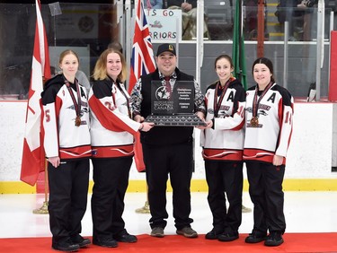 Debden Roadrunners players accept their championship trophy at the 2022 Broomball Canada National Juvenile Championship on Saturday April 16, 2022 in Cornwall, Ont. They won the gold-medal match against the Eastern Thunder 3-0. Robert Lefebvre/Special to the Cornwall Standard-Freeholder/Postmedia Network