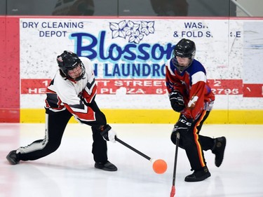 A Warriors player (left) and Frost player seen in Broomball Canada National Juvenile Championship play on Thursday April 14, 2022 in Cornwall, Ont. The Warriors won 3-2. Robert Lefebvre/Special to the Cornwall Standard-Freeholder/Postmedia Network