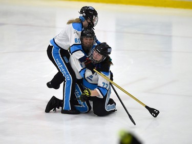 Palmerston Terminator Dakota Sarty (bottom) celebrates her goal against the Aberdeen Attackers with Meg Morgan and Avrie Goetz  in Broomball Canada National Juvenile Championship play on Thursday April 14, 2022 in Cornwall, Ont. The Terminator won 1-0. Robert Lefebvre/Special to the Cornwall Standard-Freeholder/Postmedia Network