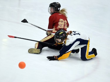 T-Miss player Eva Rose Pedneault Rioux and Eastern Thunder Olivia Kadlecik get tied up in Broomball Canada National Juvenile Championship play on Thursday April 14, 2022 in Cornwall, Ont. The T-Miss won 3-2. Robert Lefebvre/Special to the Cornwall Standard-Freeholder/Postmedia Network