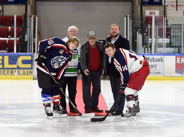 The ceremonial faceoff the Charity Cup, with West End captain Ewan McMaster, left, Cornwall Mayor Glen Grant, St. Vincent de Paul director Tom Thompson, Stormont-Dundas-South Glengarry MP Eric Duncan, and East End captain Tyson Zimmer, on Wednesday April 6, 2022 in Cornwall, Ont. The 'East' end won 6-4. Robert Lefebvre/Special to the Cornwall Standard-Freeholder/Postmedia Network