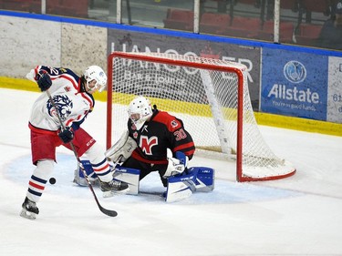 Nepean Raiders goaltender Nathan Loisel has to deal with a rebound and Cornwall Colts Brayden Bowen during play on Saturday April 9, 2022 in Cornwall, Ont. Cornwall won 4-2. Robert Lefebvre/Special to the Cornwall Standard-Freeholder/Postmedia Network