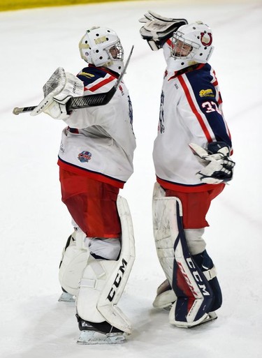 Cornwall Colts goaltenders Emile Savoie, left, and Dax Easter, ready for a post-win hug after play against the Nepean Raiders on Saturday April 9, 2022 in Cornwall, Ont. Cornwall won 4-2. Robert Lefebvre/Special to the Cornwall Standard-Freeholder/Postmedia Network