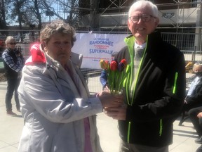 Handout/Cornwall Standard-Freeholder/Postmedia Network
Parkinson Awareness co-ordinator Virginia Lake, left, presents tulips to Cornwall Mayor Glen Grant on Monday, April 11, 2022.