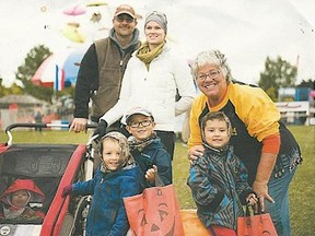 Connie Barker (right), a Pumpkinfest original, shown with her family, earned a Volunteer of the Year award from Festivals & Events Ontario. [Submitted]
