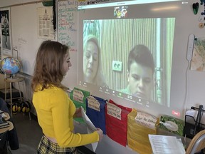 Zoe Danielczak and the rest of Mr. Belsey’s Grade 6 class at RancheView School speak to Natalia and her son Serge in central Ukraine via Zoom.