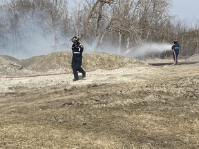 Firefighters were on the scene battling a grass fire in south Beaumont for over four hours Monday. (Ted Murphy)