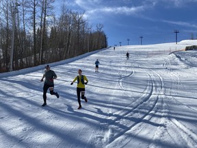 Runners raced up and down the groomed slopes of Rabbit Hill Snow Resort last Sunday in the inaugural Hill of a Race. (Ted Murphy)
