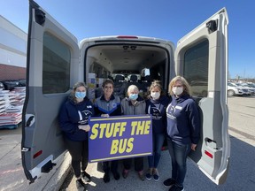 Goderich Place's 'Stuff The Bus' donated over $400 in cash and over $1,000 in groceries to the St. Vincent de Paul food bank. (L-R): Heidi Pugh, Activity Manager, Pat Clifford, President of St. Vincent de Paul Goderich, Donna Murray, resident at Goderich Place, Annette Gerdes, General Manager and Susie Olson, Salsa Manager. Kathleen Smith