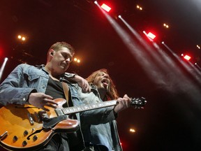 Brothers Jay, left, and Brett Emmons of The Glorious Sons perform at the Leon's Centre in Kingston, Ont., on Friday, April 15, 2022.