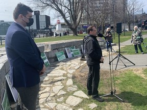 Kingston and the Islands Green Party candidate Zachary Typhair and Ontario Green Party Leader Mike Schreiner speak to supporters at Confederation Park in Kingston on Sunday.