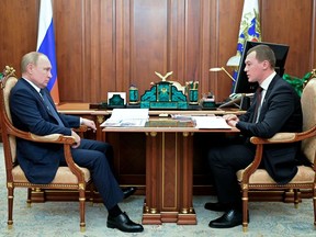 Russian President Vladimir Putin attends a meeting with Governor of Khabarovsk Region Mikhail Degtyaryov in Moscow, Russia, on April 28.