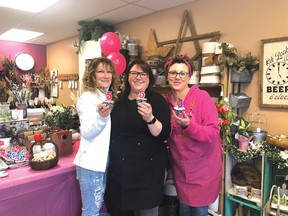 Claire Siren (left) and Abigail Duff (right) helped Denise Connelly (middle) celebrate her shop's 5th anniversary on April 1.