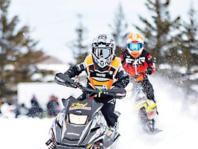 Photo supplied
Nash Hayden #910 takes a jump on his grey Briggs Stratton sled. For the story, see page 2.