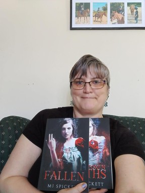 Local author Margreat Davis with her latest novels Fallen and Unspoken Oaths.  Book 1 & 2 of the Women of Ravenwood series.