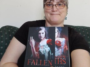 Local author Margreat Davis with her latest novels Fallen and Unspoken Oaths. Book 1 & 2 of the Women of Ravenwood series.