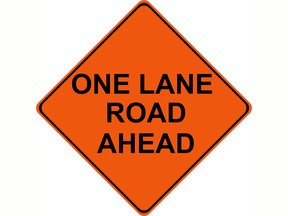 One Lane Road Ahead traffic warning sign
