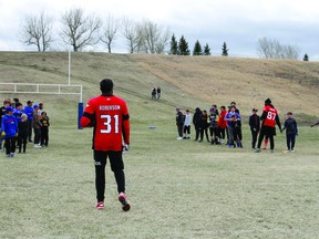 Professional Calgary Stampeders, Richie Sindani and Tre Roberson, ran kids through various football drills and practices during the 2022 Stamps Camp in Pincher Creek.