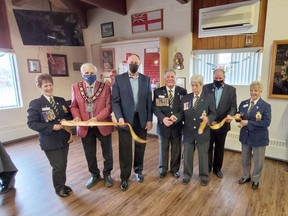 Conducting the official ribbon cutting ceremony of the Pembroke Legion's renovations and upgrades including to the lounge, was, from left, Laurette Halliday, Pembroke Mayor Mike LeMay, MPP John Yakabuski, President Stan Halliday, June Anderson, Laurentian Valley Mayor Steve Bennett, and Liz Leblanc. Anthony Dixon
