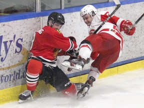 Nathan Duck of the Pembroke Lumber Kings and Nicholas Dowling of the Brockville Braves collide during first period action in game six of their quarter-final series on Wednesday night at the Pembroke Memorial Centre. Anthony Dixon