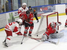Brockville goaltender Sami Molu gets the paddle down to stop a wrap around attempt by Pembroke's Caden Eaton during game six of their CCHL first round playoff series Wednesday night at the Pembroke Memorial Centre. Anthony Dixon/Postmedia Network