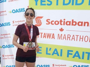 Jess Lambert with her medal having run her first half marathon in Ottawa in 2019. Submitted photo