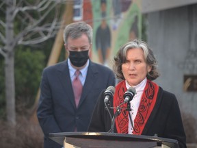 OTTAWA, March 25, 2021: Chief Wendy Jocko of Algonquins of Pikwakanagan First Nation speaks during a ceremony to mark the anniversary of the first death from COVID-19 during a remembrance ceremony at Marion Dewar Plaza at Ottawa City Hall on March 25, 2021. Ottawa Mayor Jim Watson, left, listens in. BLAIR CRAWFORD/Postmedia.