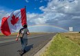 Chad Kennedy holds a Canadian flag for a practice walk across Southern Alberta in Sept 2020, in preparation for the current trek across Canada to raise awareness of PTSD.