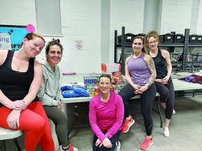 Stefanie Maione, second from right, provides free fitness training in return for food donations to St. Vincent Place. She is here with some of her students. PHOTO PROVIDED