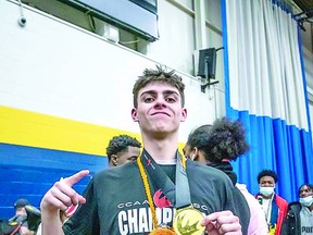 Brett Pearce shows off his championship medal as a member of the Humber College Hawks men's basketball team. SPECIAL TO SAULT THIS WEEK