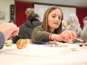 Ava D'Andrea, 10, practices pysanky at St. George's Ukrainian church in Sarnia Saturday. Instruction in the Ukrainian Easter egg decorating technique was part of a fundraiser to help support Ukrainian refugees coming to Sarnia, an organizer said. (Tyler Kula/ The Observer)